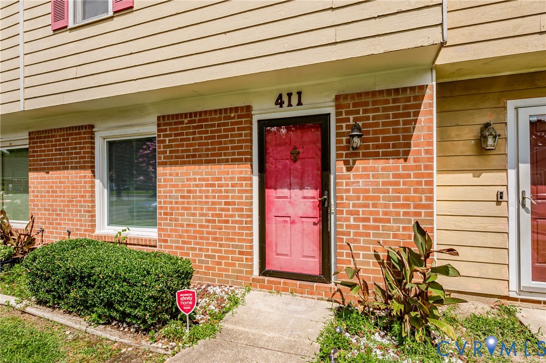 Brick facade with beige siding