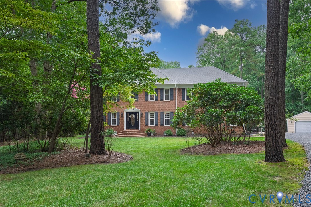 Brick exterior home set among mature trees
