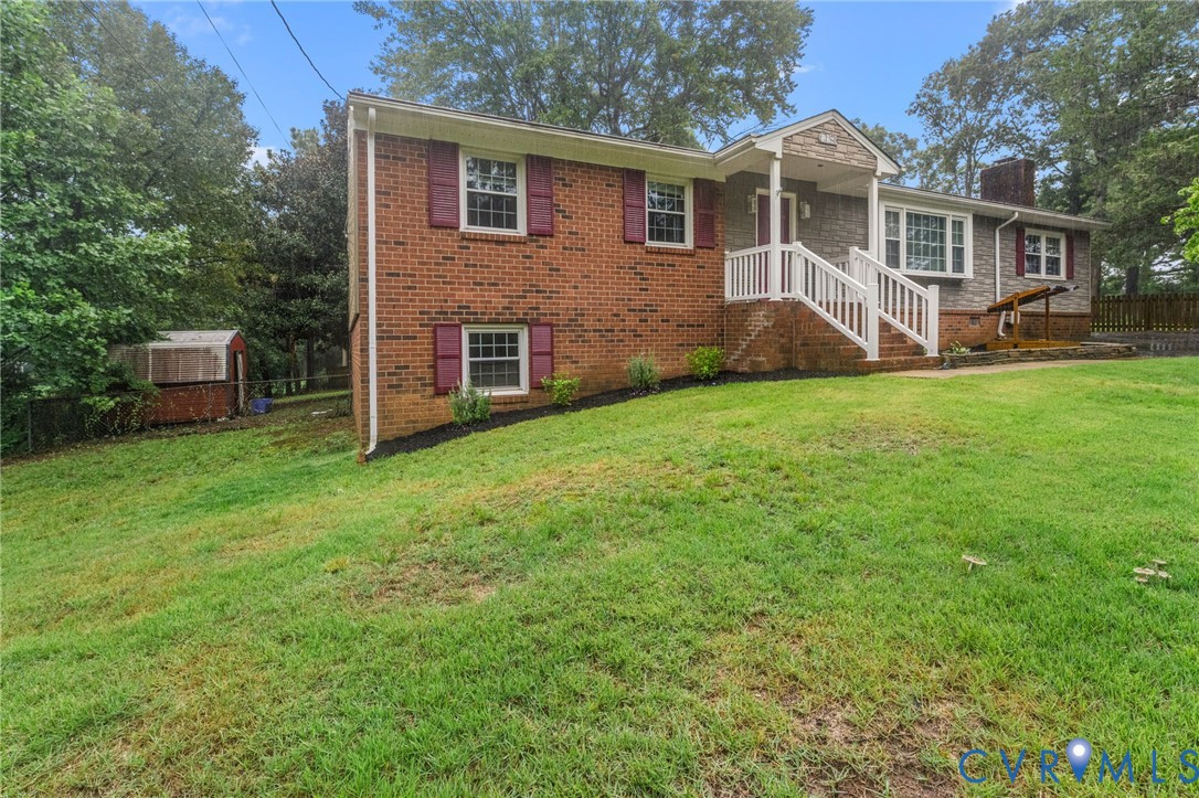 Brick and siding exterior with white railing porch Brick and siding exterior with white railing porch