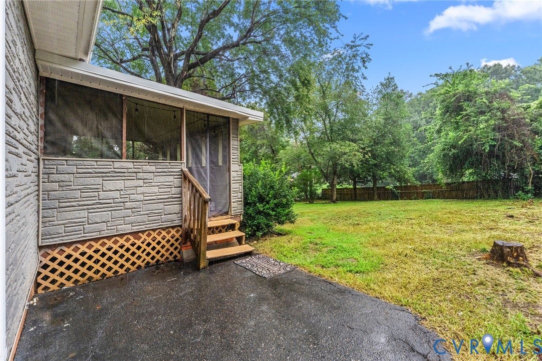 Screened porch with wood steps and railing Screened porch with wood steps and railing