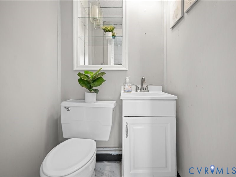 First floor half bath.  Off the mud room.