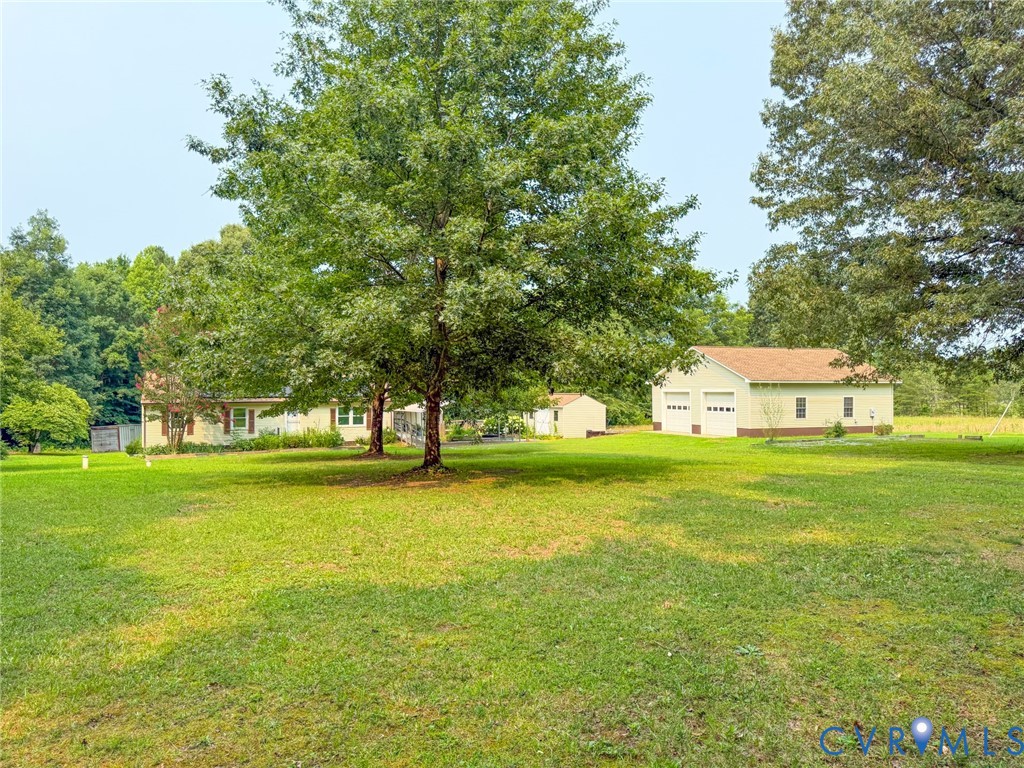 Expansive green lawn with mature trees