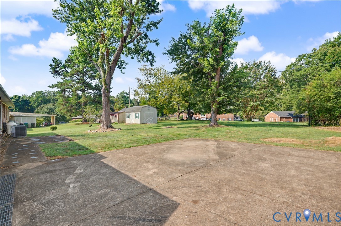 View of backyard from garage entrance