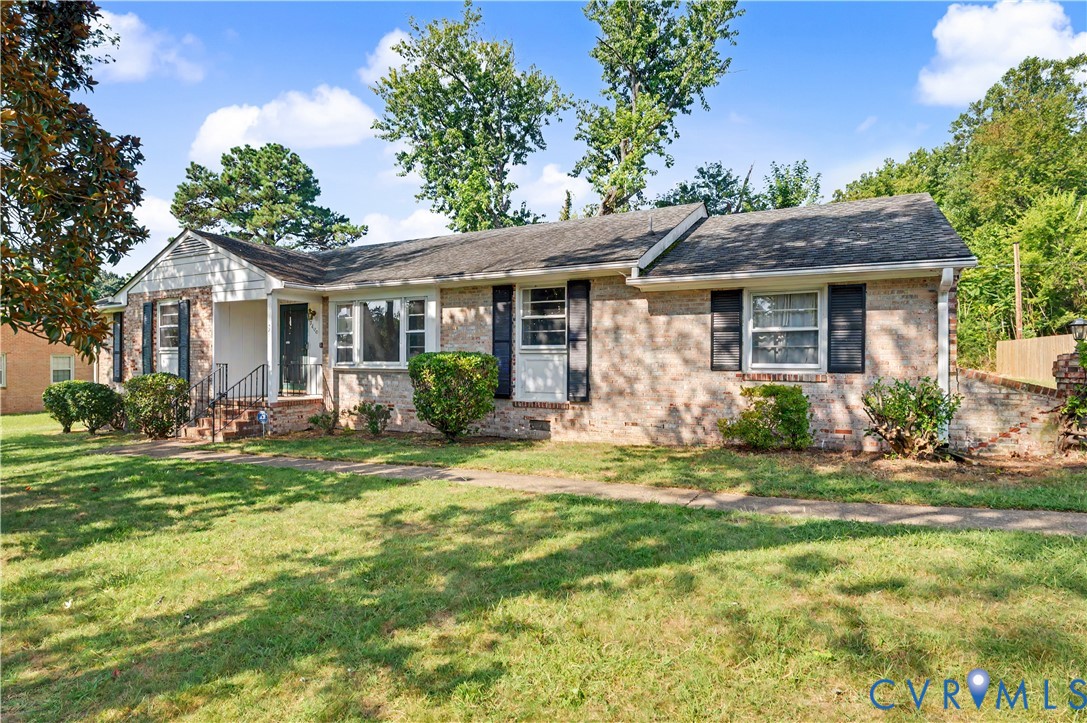 All brick one level ranch style home with garage