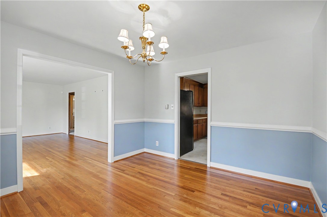 View from dining room to living room and kitchen