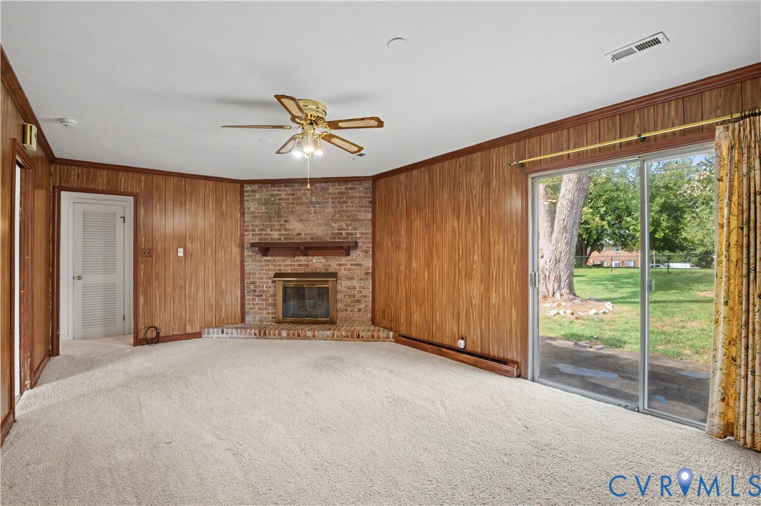 Great room with fireplace and sliding doors to patio