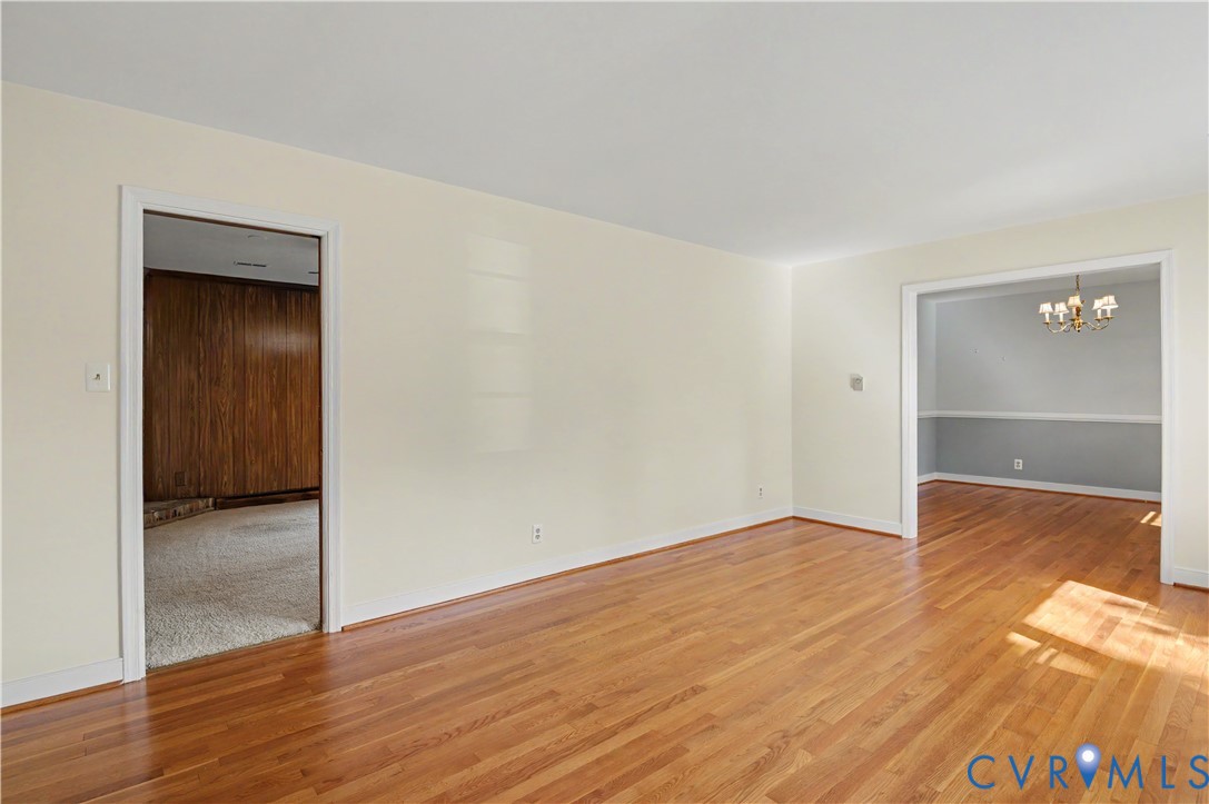 View from front living room to family room on left and dining room on right