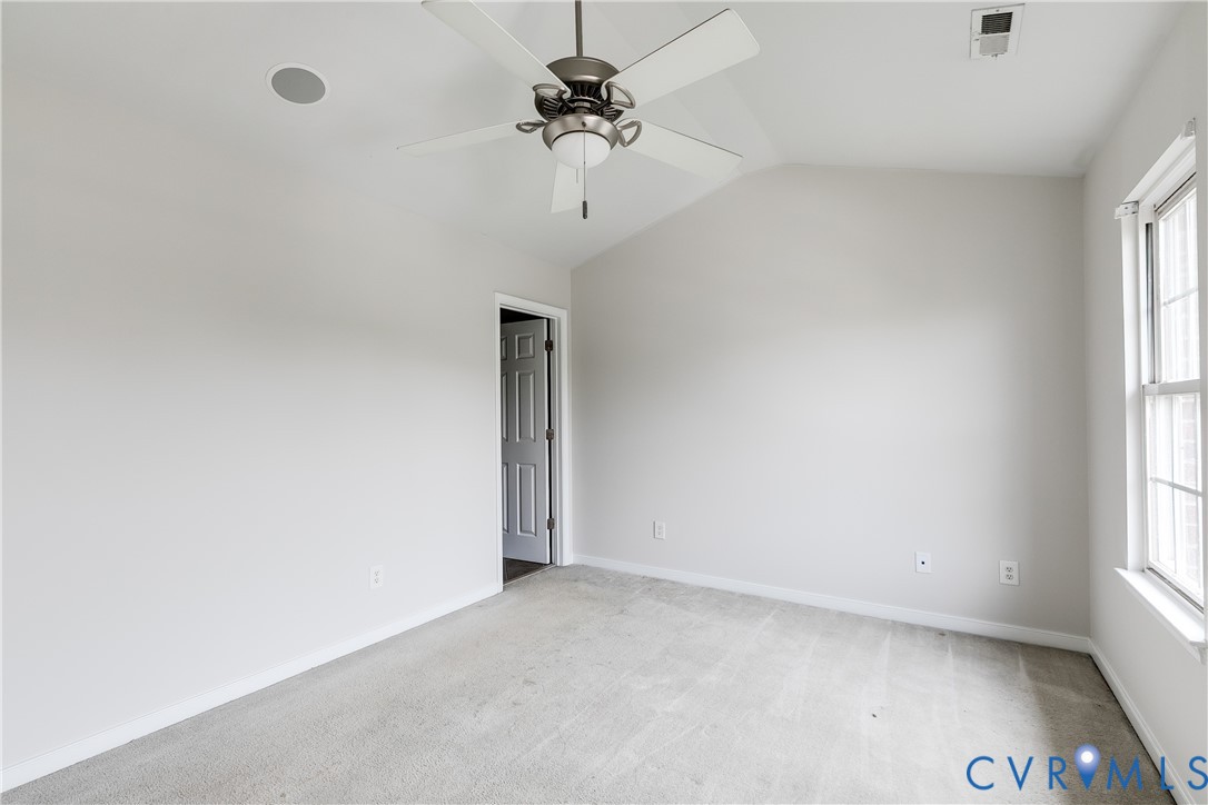 Room featuring light-toned carpeting and neutral wall paint