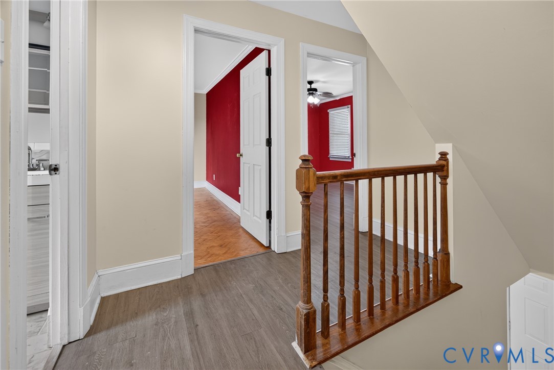 Wood-finish flooring with neutral wall paint and white trim