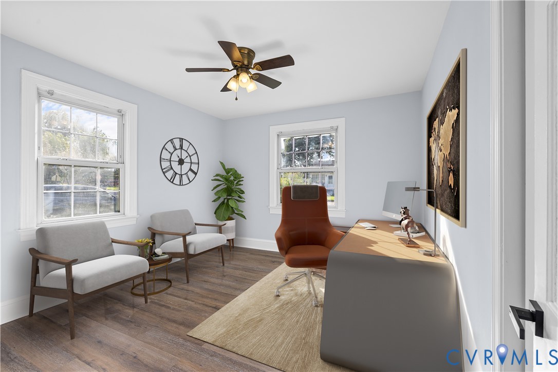 (Virtually-Staged) Wood-finish flooring, multiple windows, ceiling fan with integrated lighting, and light-colored walls