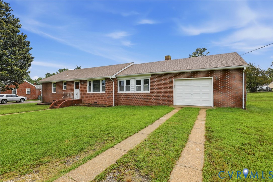 Brick exterior, attached garage, concrete driveway, front porch, and shingled roof Brick exterior, attached garage, concrete driveway, front porch, and shingled roof