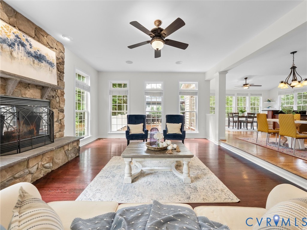 Stone-clad fireplace with a wood mantel