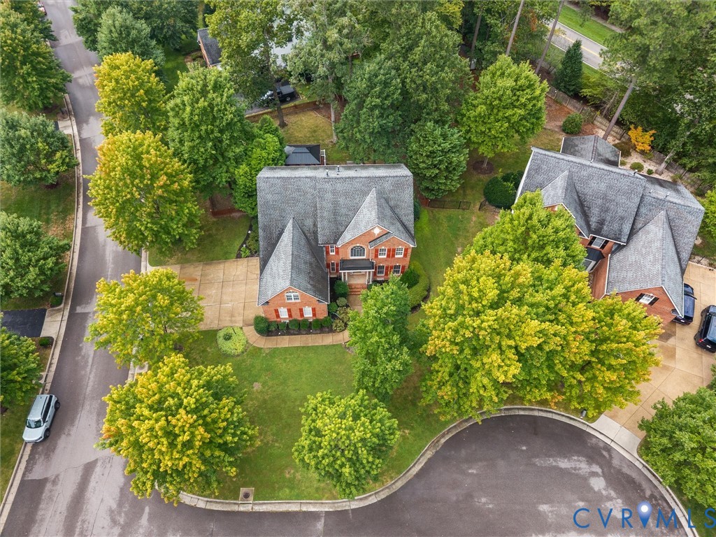 Red brick exterior with multiple gables and a gray shingle roof