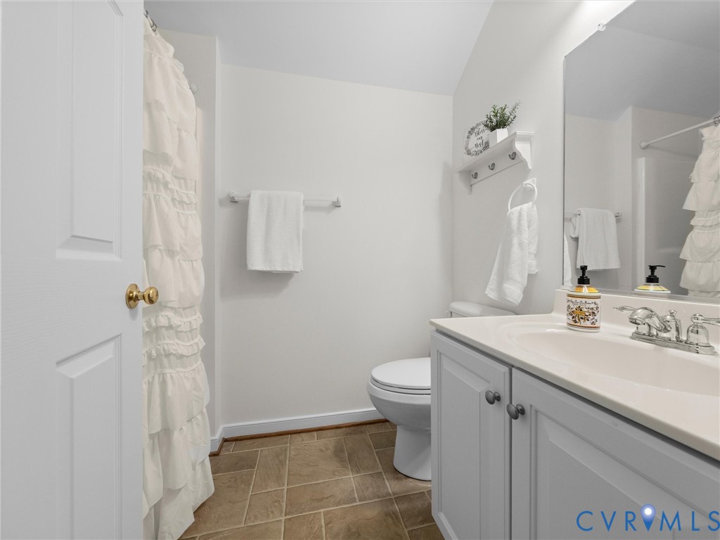 White vanity with integrated sink and chrome fixtures