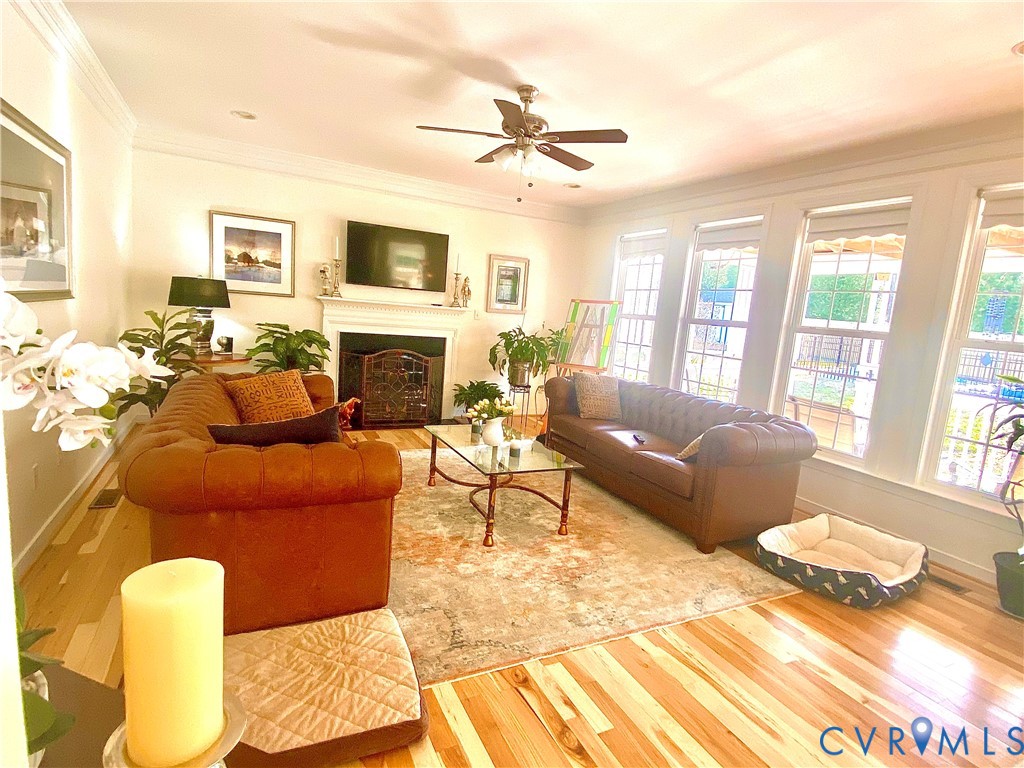Living area featuring light wood-finish flooring and a decorative area rug