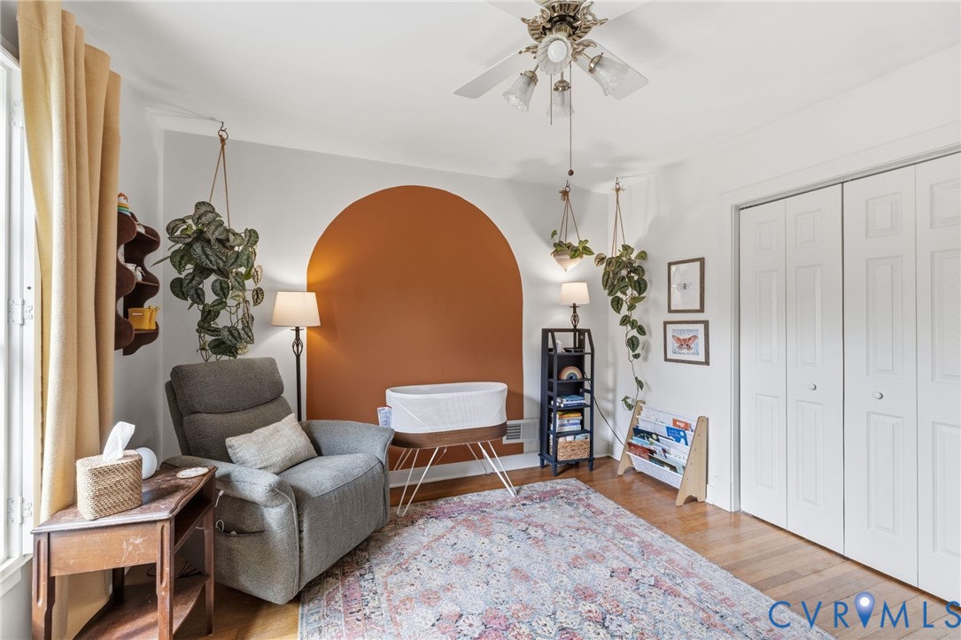 Hardwood flooring complemented by a patterned area rug