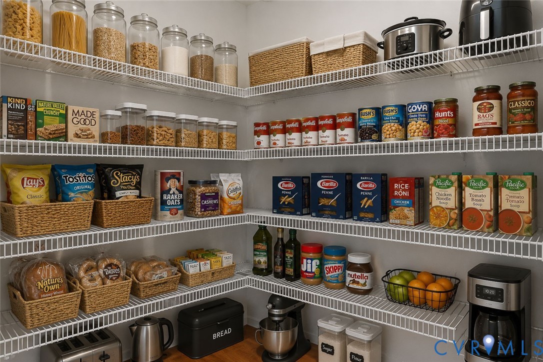 Comprehensive pantry featuring white wire shelving