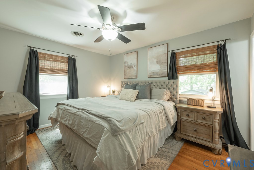 Primary Bedroom with Ensuite Bath, Ceiling Fan, Closet and 2 Windows located at the back of the home.