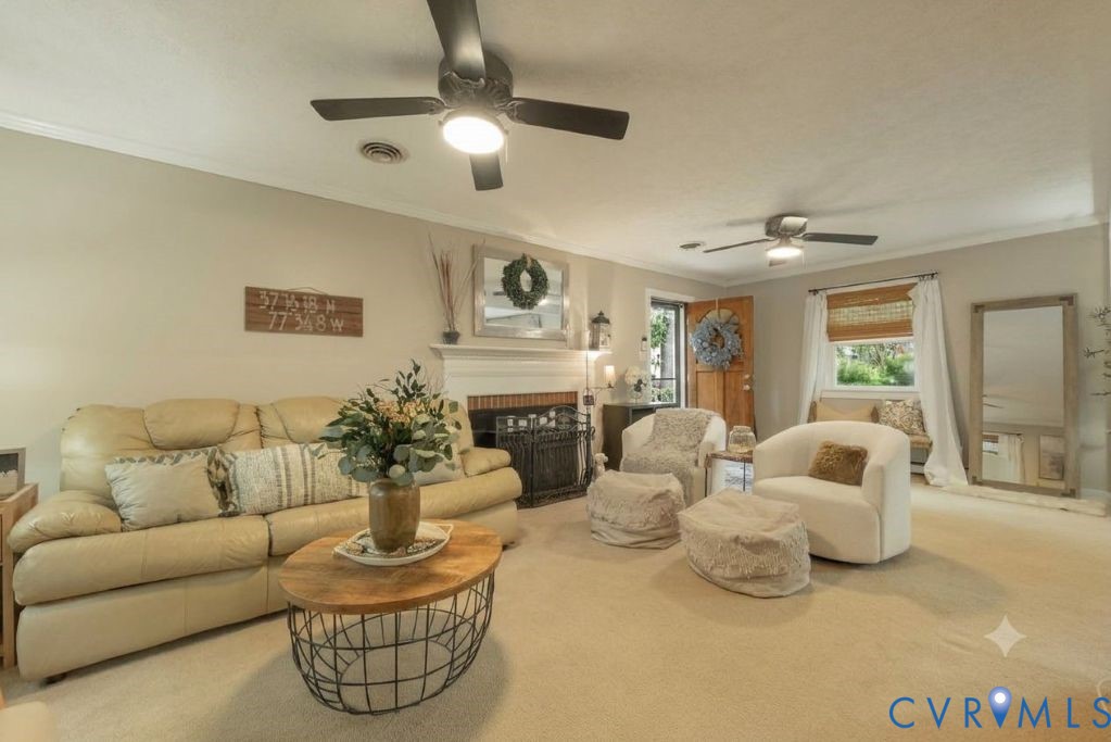 Spacious Family Room with Brick Fireplace and side entry access.