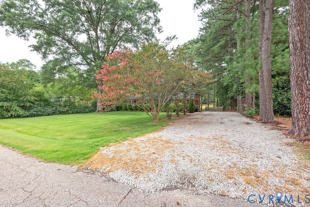 View of the wide driveway from the road
