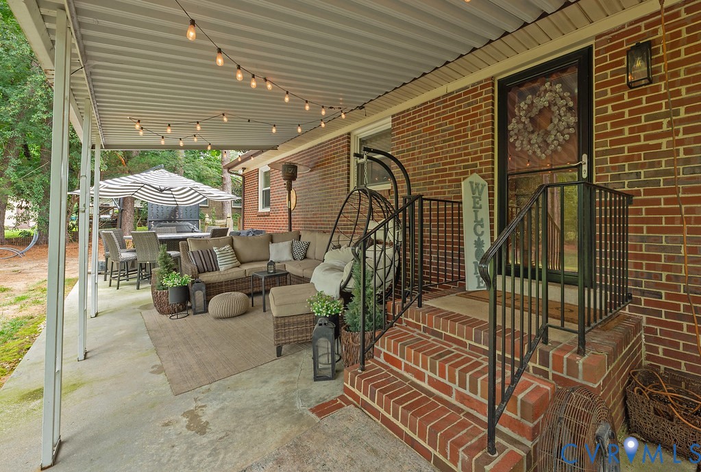 View of covered patio and stairs