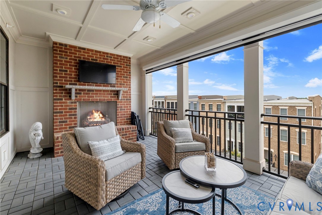 Covered porch with remote shade to keep cool and fireplace to keep warm!