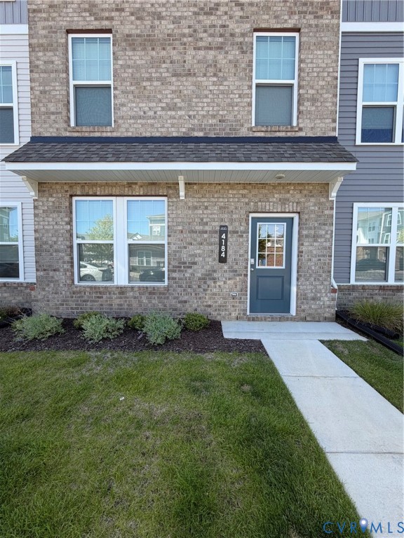 Brick and siding exterior featuring a covered entry porch Brick and siding exterior featuring a covered entry porch