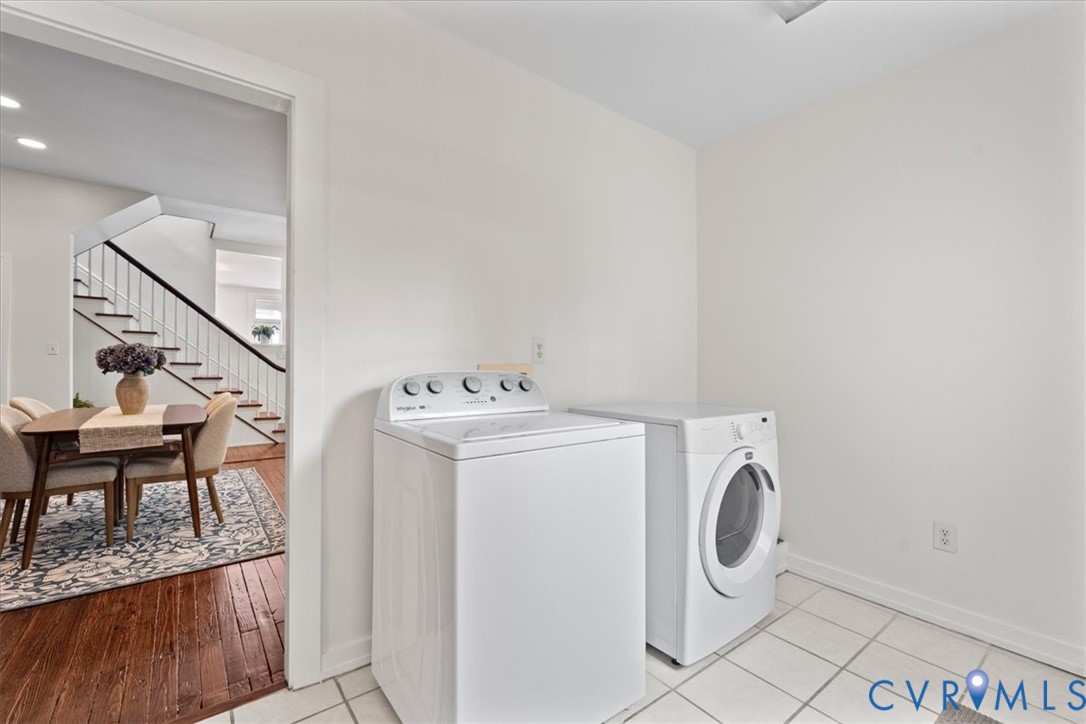 White tile flooring complements the bright wall finishes