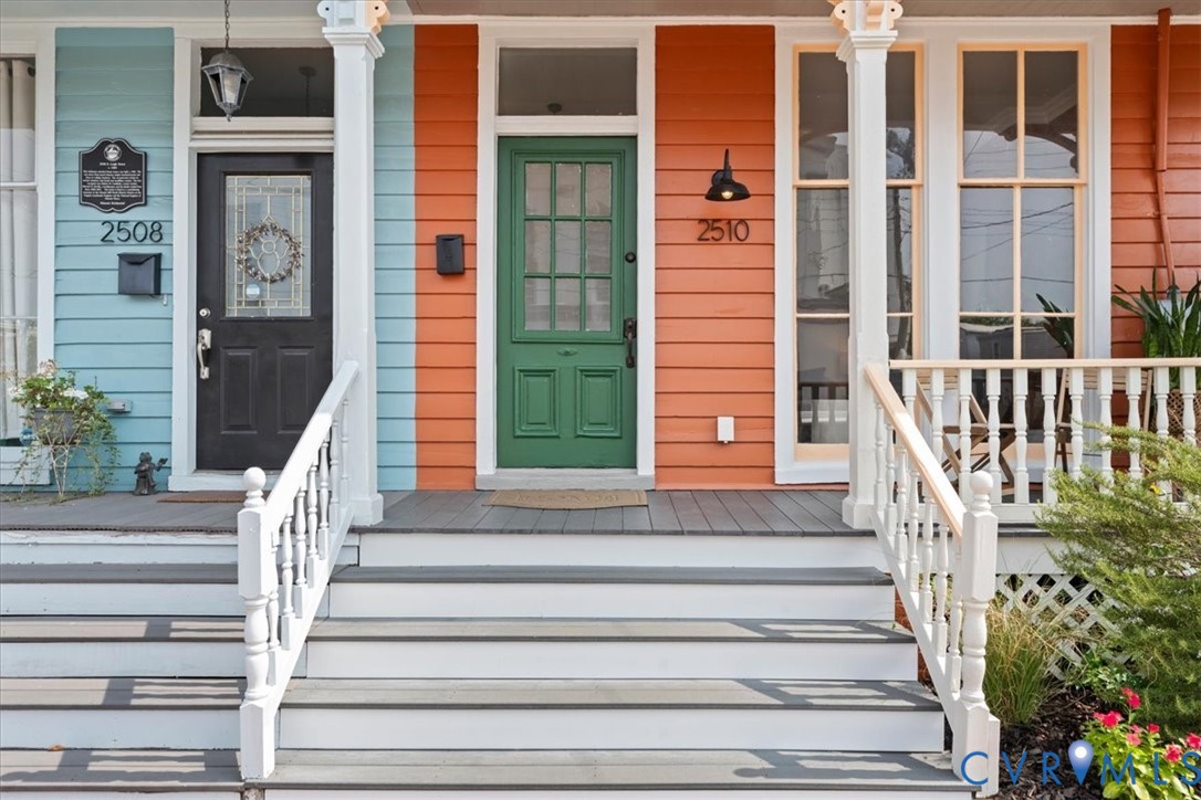 Front porch entry with painted wood siding
