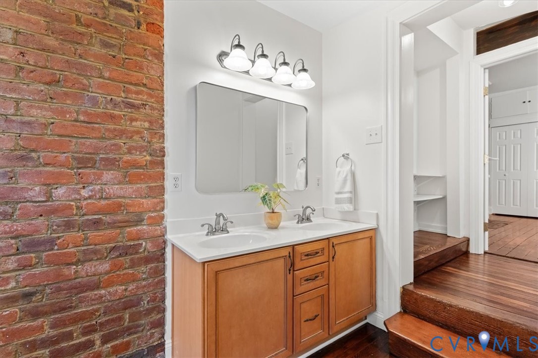 Dual vanity with built-in cabinetry and white countertop