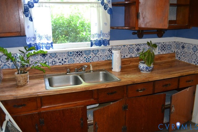 Wood-finish countertops with a double basin stainless steel sink