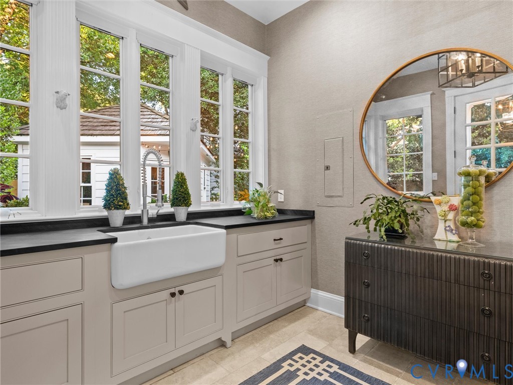 Garden room/mudroom with a vaulted ceiling, heated floors and built-in cabinets
