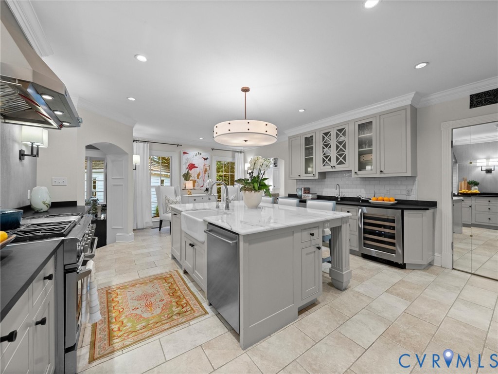 Kitchen is eat-in w/marble island and soapstone counters