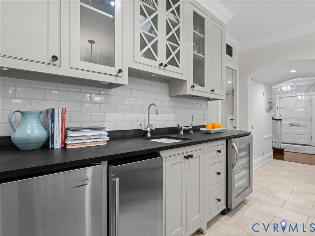 Kitchen equipped with full entertainment wall