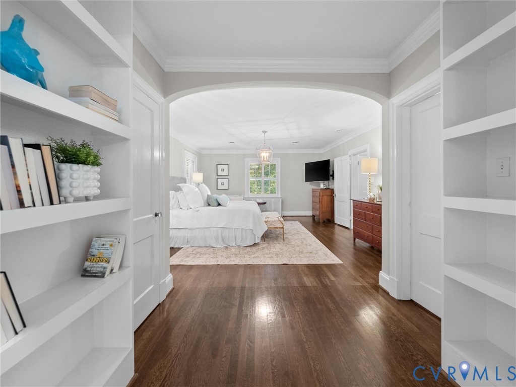 Primary bedroom with built-in bookcases