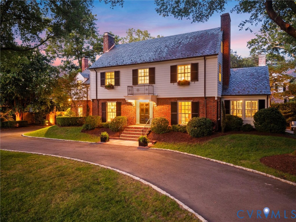 Twilight view showing circular driveway and cobblestone edge Twilight view showing circular driveway and cobblestone edge