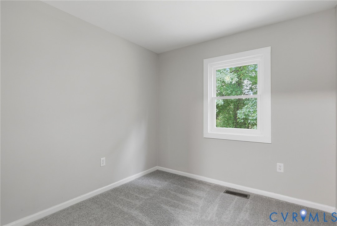 Neutral gray walls complement the gray carpeting