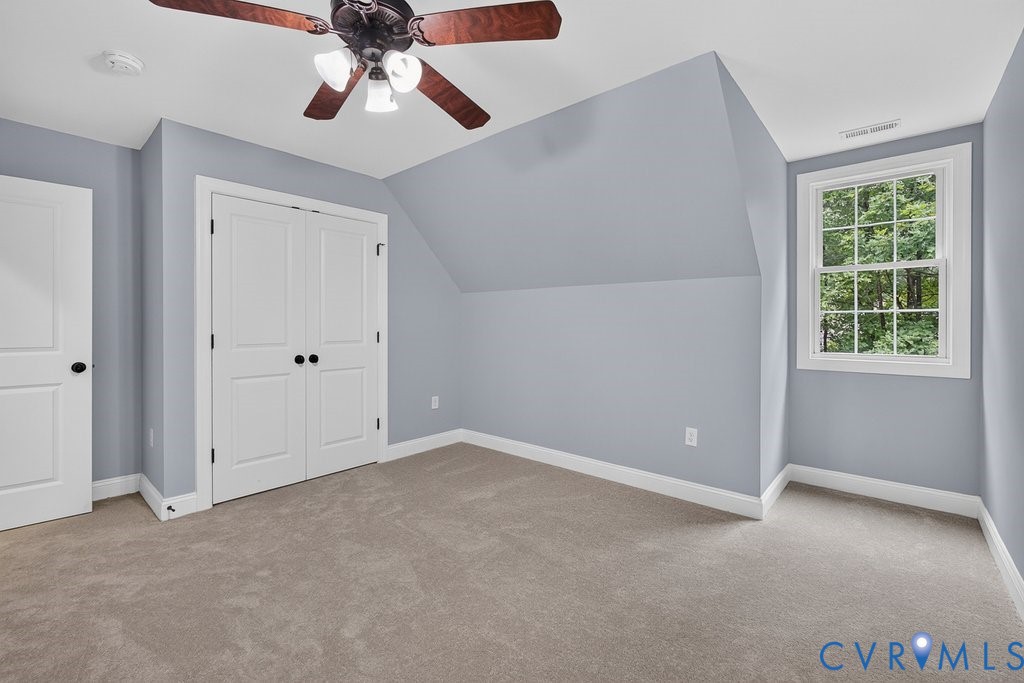 Soft gray wall color with white trim