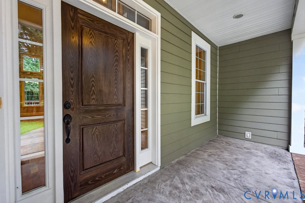 Solid wood entry door with sidelights and transom window