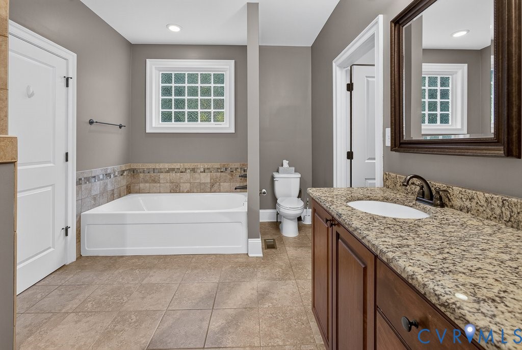 Built-in soaking tub with decorative tile surround