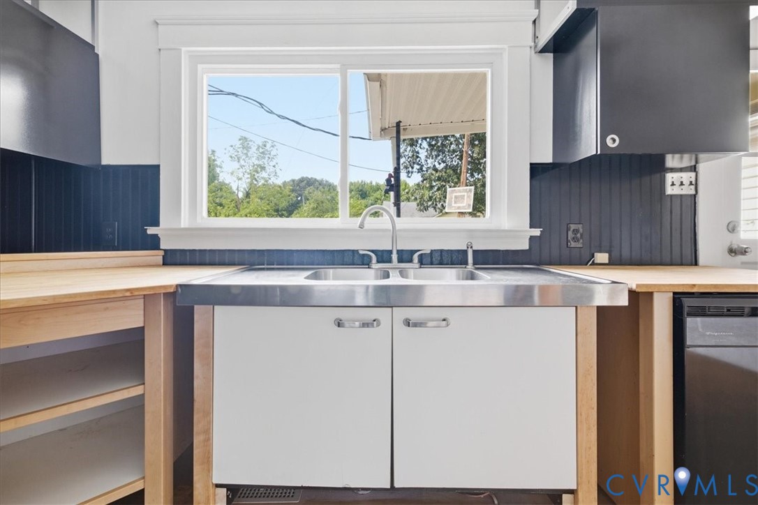 Dual basin stainless steel sink with a chrome faucet