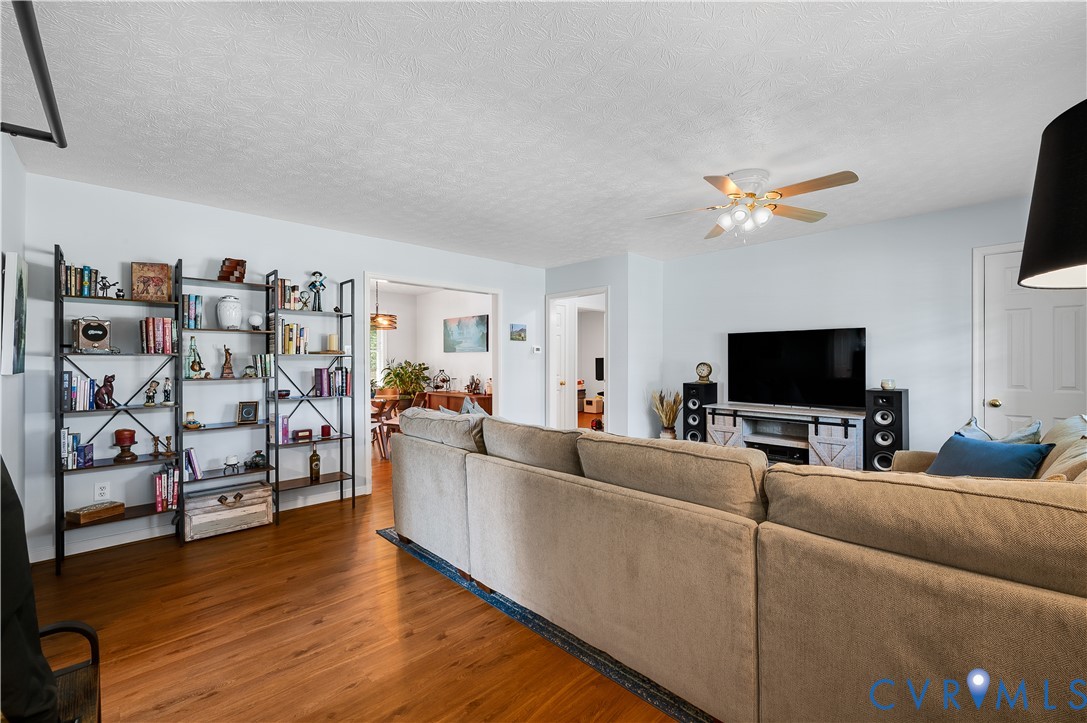 Spacious living room featuring hardwood flooring. Spacious living room featuring hardwood flooring.