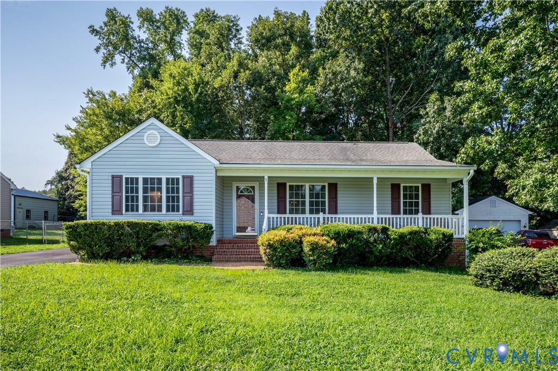 Front of home featuring covered front porch.