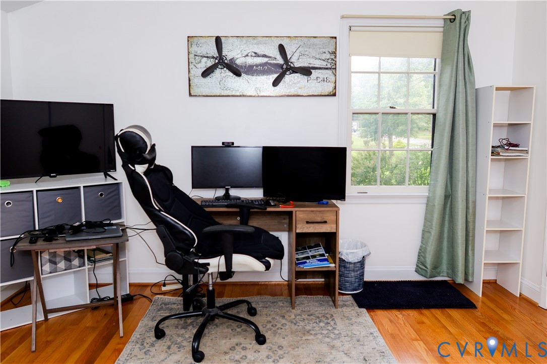 Third bedroom or office w/ Hardwood flooring.