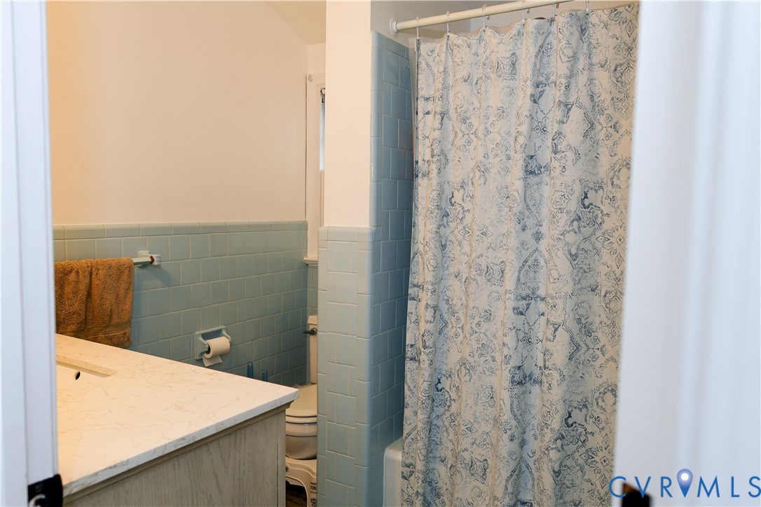 Second floor Bathroom with full tub and shower.