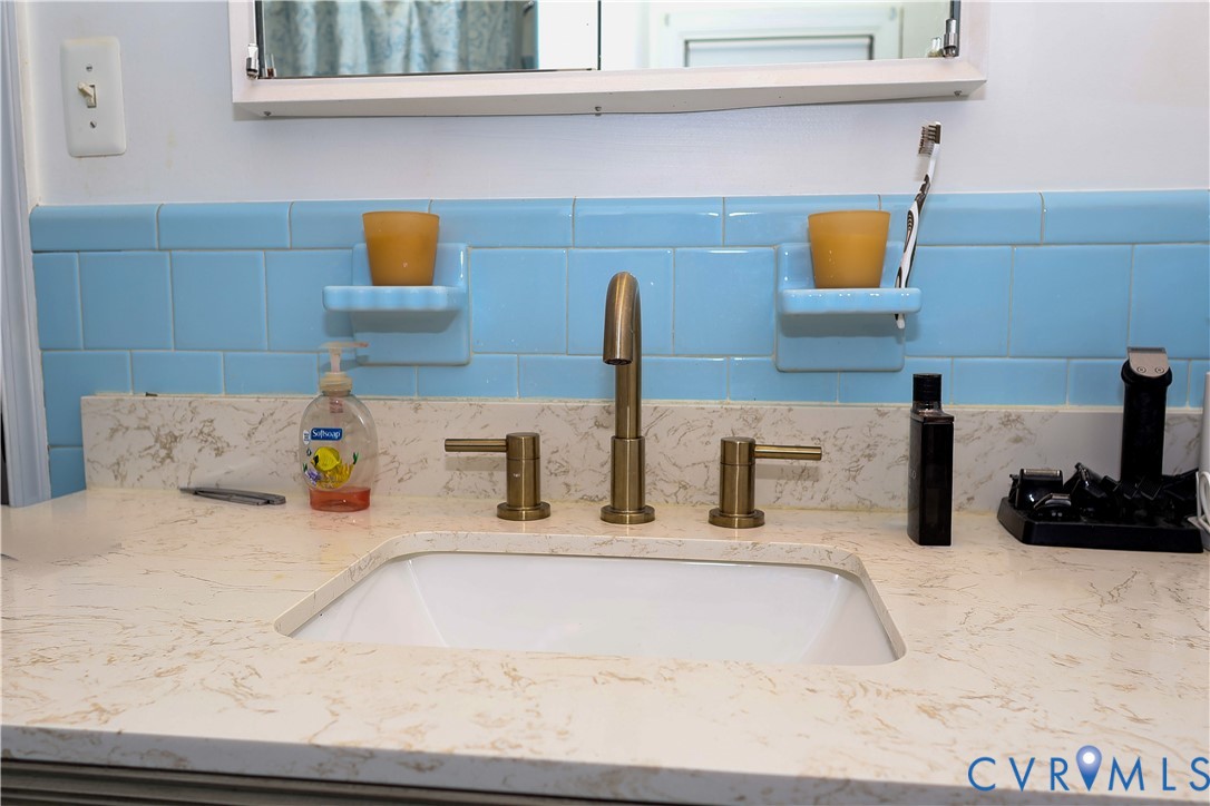Integrated rectangular sink with a light-toned countertop.