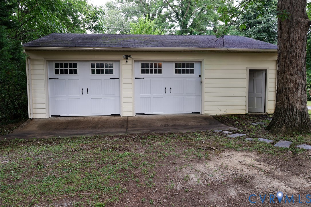 Detached two-car garage with an auxiliary side entrance