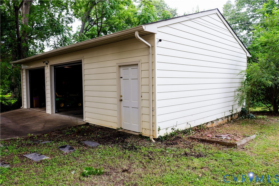 Detached two-car garage with an auxiliary side entrance
