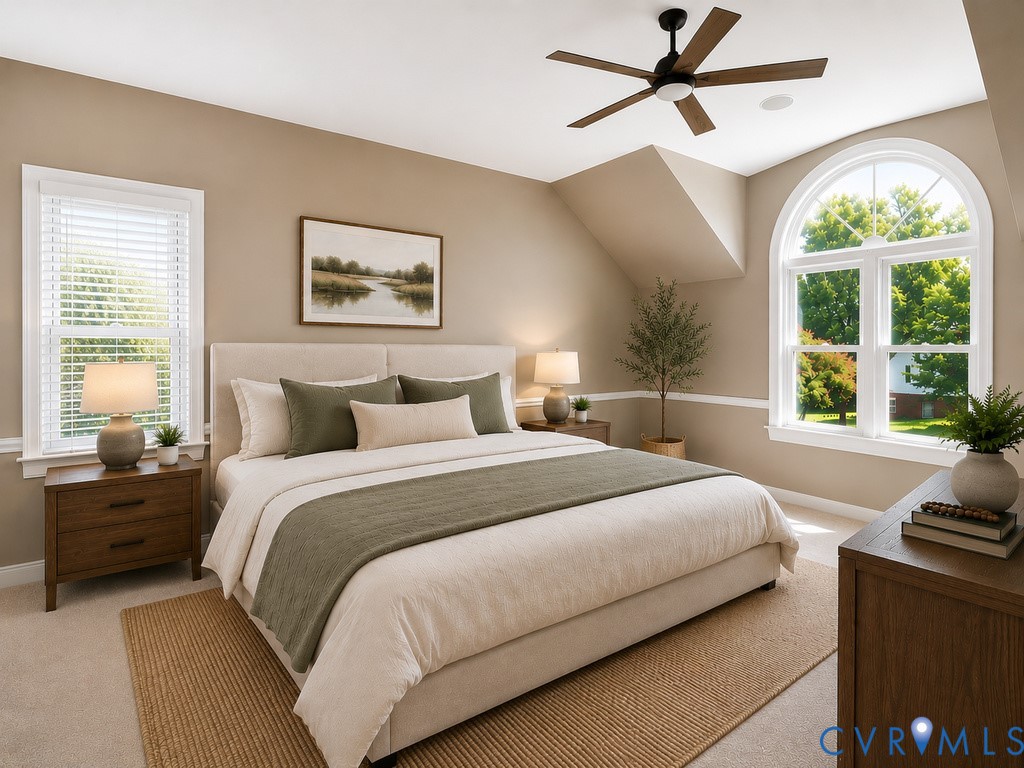 Arched window, rectangular window with blinds, ceiling fan, carpeted flooring, and wall molding