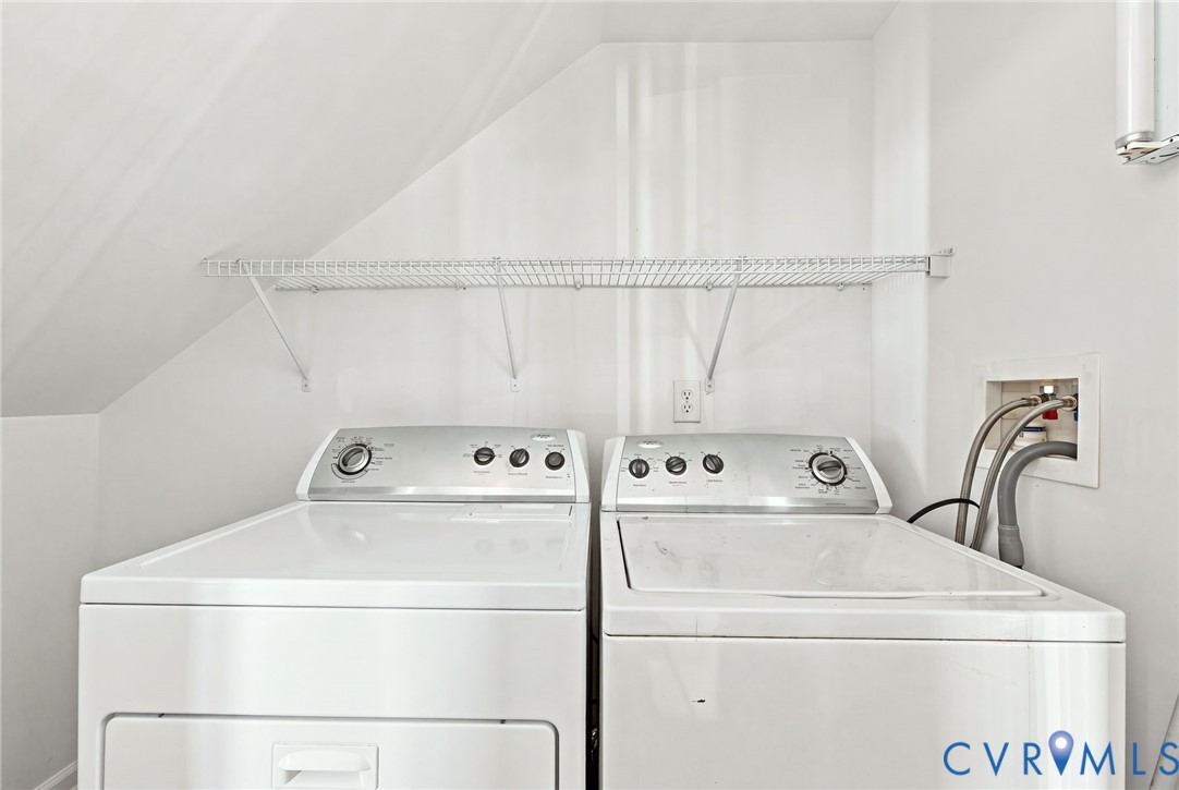 Laundry area with sloped ceiling and wire shelving